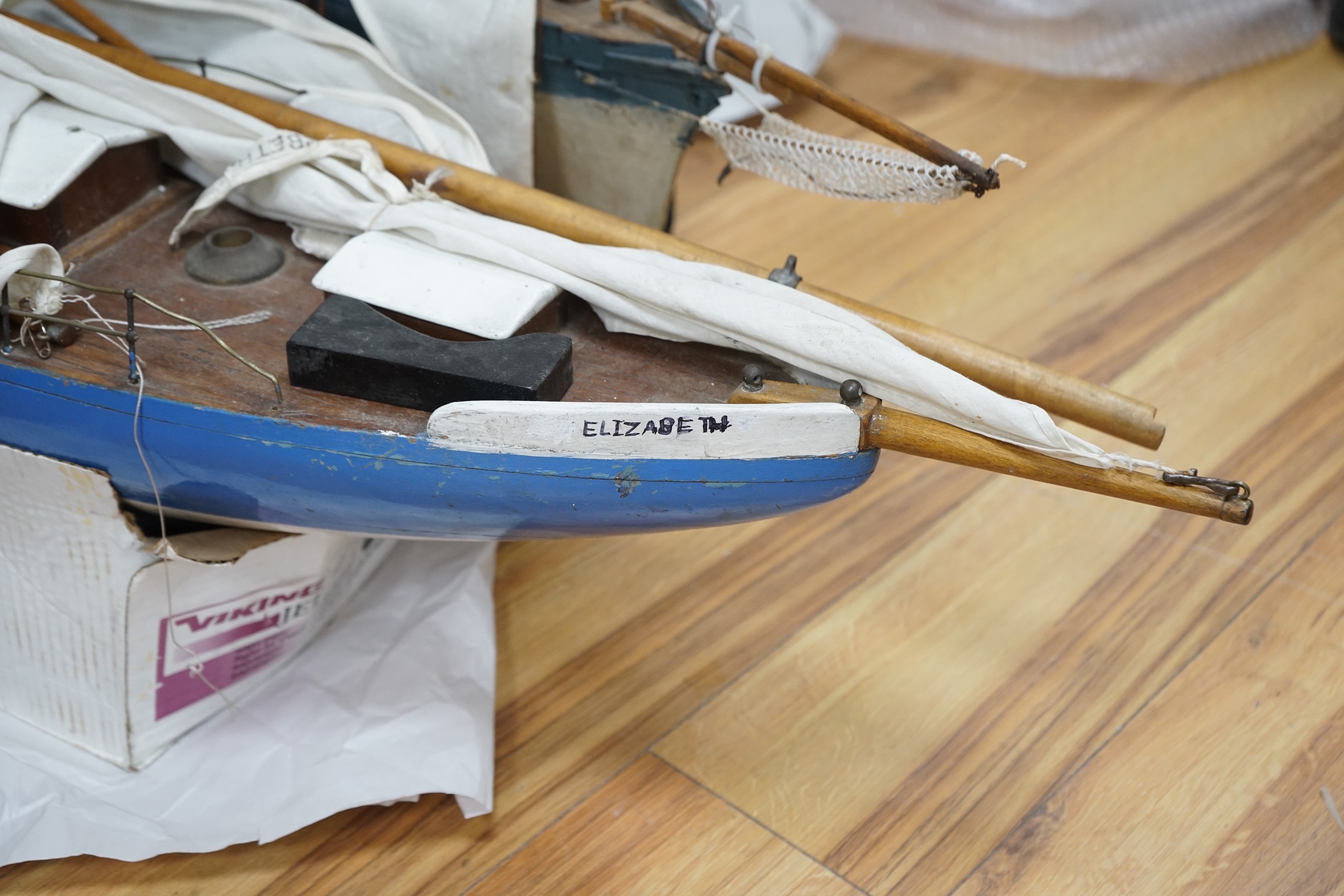 Two large over-painted pond yachts, largest 91cms